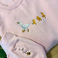 Marching Ducks Embroidered Sweater